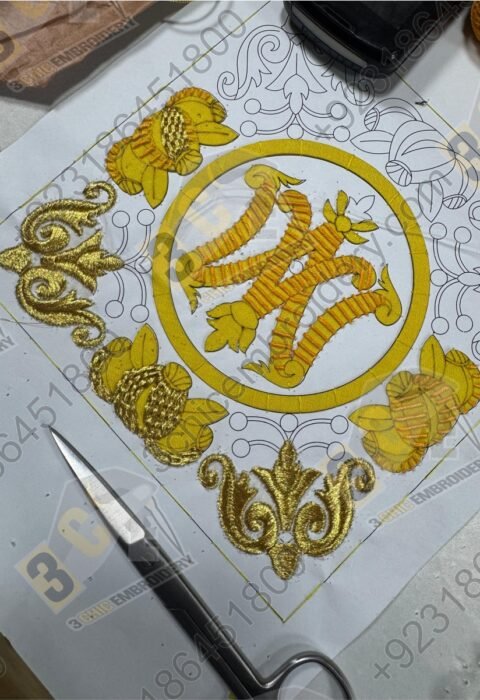 Hand embroidery goldwork badge in progress with silk and metallic threads by 3Chic Embroidery