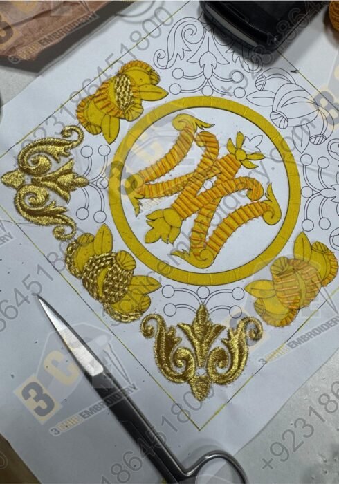 Hand embroidery goldwork badge in progress with silk and metallic threads by 3Chic Embroidery